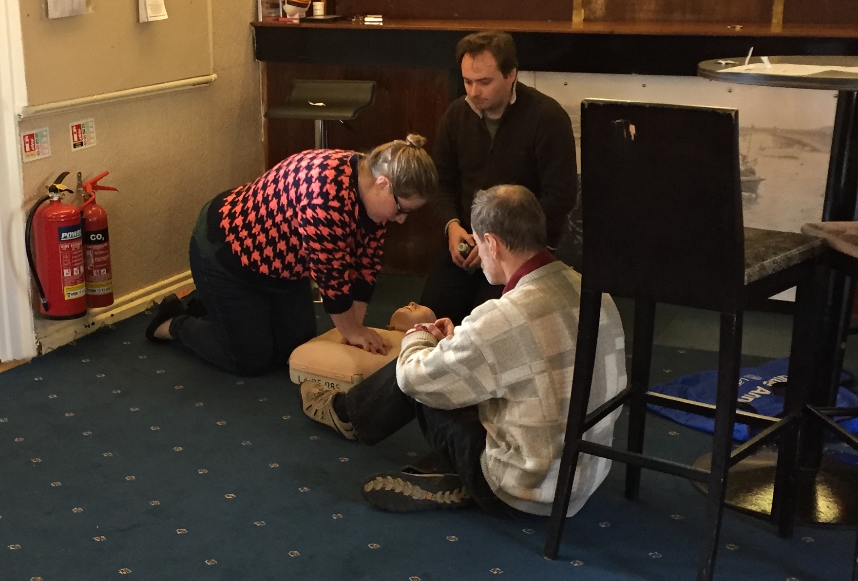 Club members practicing resuscitation on a mannequin